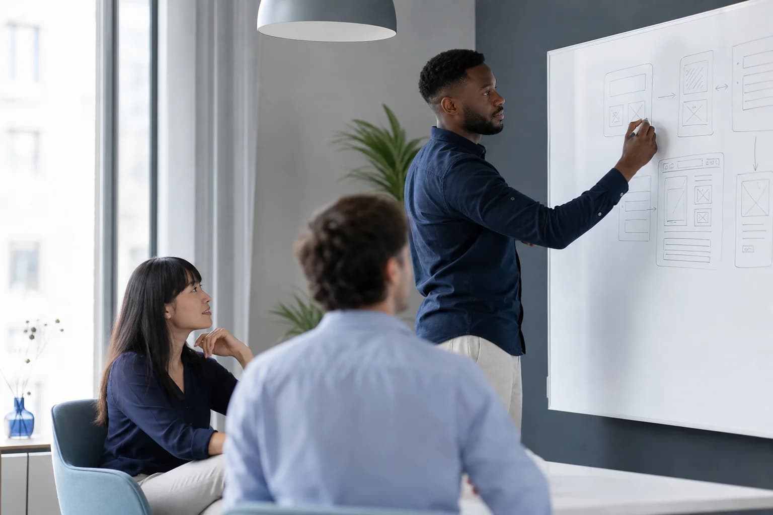 Remote engineering team discussing a React interface in a modern workspace